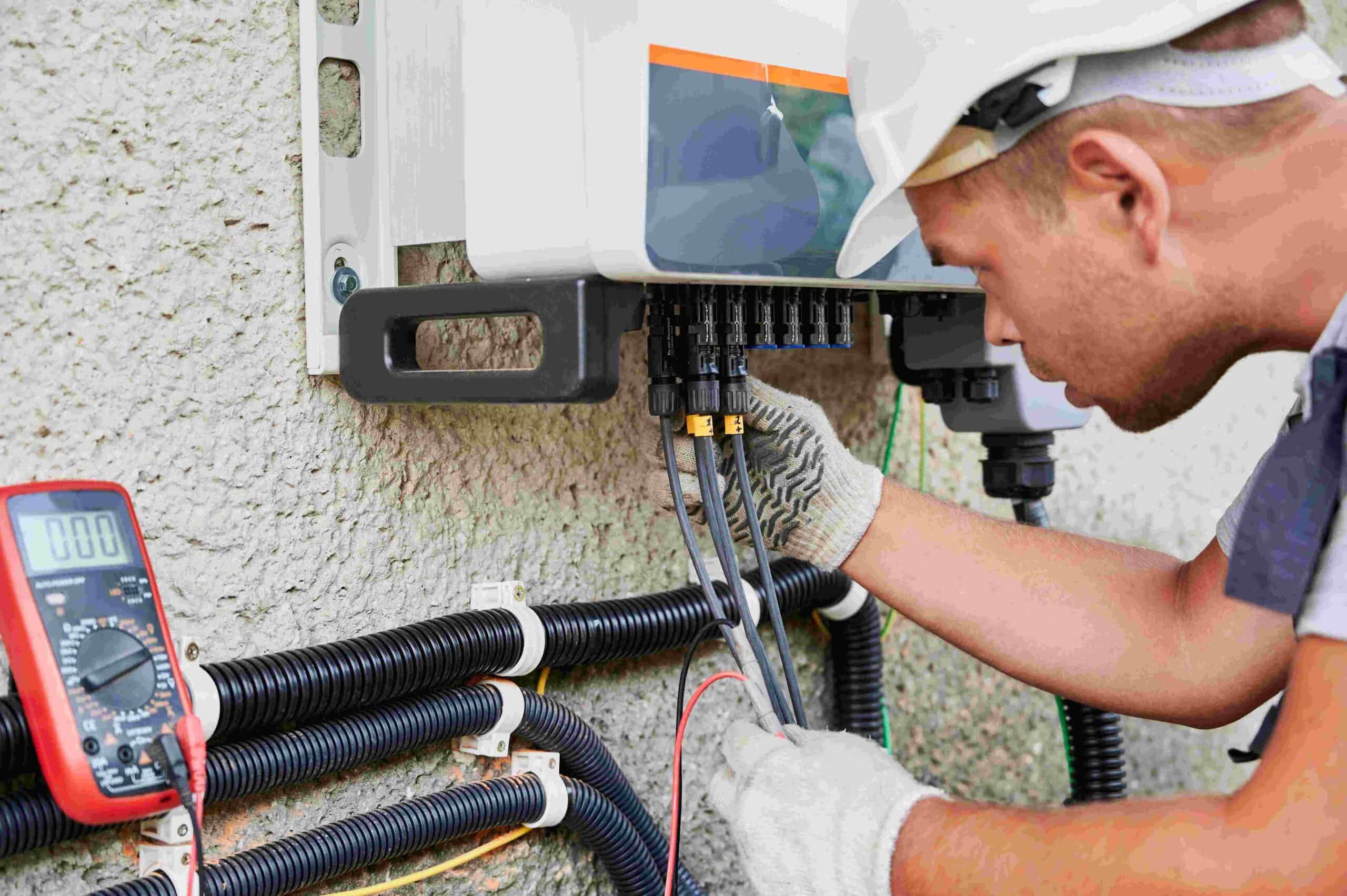 An electrician fixing some isuue with the help of a multimeter